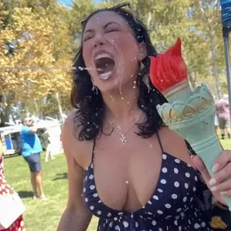 A festival-goer catching a shot of Freedom Juice